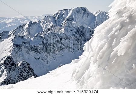 Beautiful snowy peaks in winter. View from peak Lomnicky stit in High Tatras mountains Slovakia