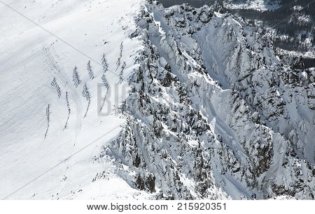 Beautiful snowy peaks in winter. View from peak Lomnicky stit in High Tatras mountains Slovakia