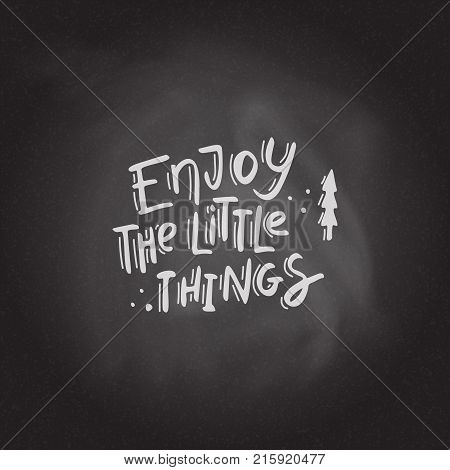 Enjoy the little things Hand drawn lettering on the blackboard background. Stock vector