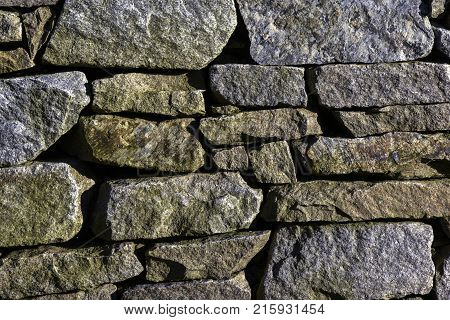 Textura large flat stones lined up. Rock granite