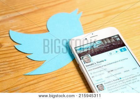JYVASKYLA FINLAND - JUNE 13 2017: The official Twitter account of Donald Trump on mobile and printed logo. The American President has over 32 million followers on Twitter. Illustrative editorial.