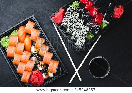 Sushi In A Black Container On A Wooden Table Colorful And Beautiful