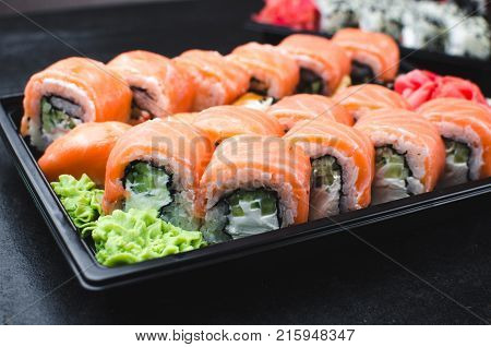 Sushi In A Black Container On A Wooden Table Colorful And Beautiful