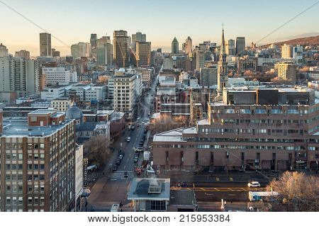 Montreal CANADA - 29 November 2017: Montreal skyline at sunrise from Place Dupuis