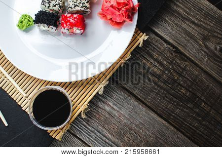 On The Plate Is White, Lined With Different Rolls, Sushi