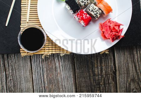 On The Plate Is White, Lined With Different Rolls, Sushi