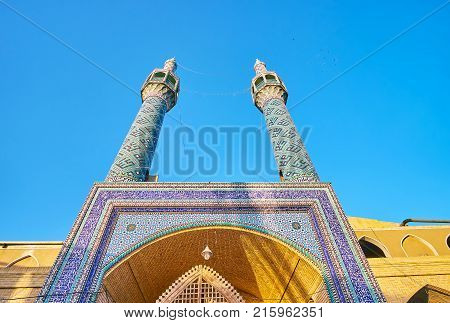 Tall minarets of Shahzade Fazl Holy Shrine decorated with tiles with geometrical pattern