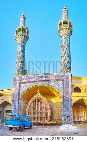 The central entrance tiled portal of Shahzade Fazel Shrine with wooden construction Nakhl in Yazd Iran