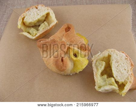 Yeast doug tartlet with vanilla pudding and rhubarb filling