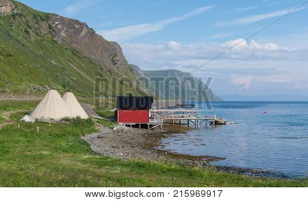 Fishermen's cabins and lavvu the traditional home of the Sami northern Norway