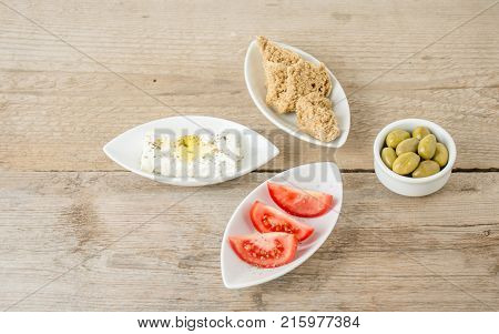 Greek Appetizers feta tomatoes and rusks. Mediterranean traditional healthy food.
