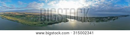 Drone Aerial 360 Degree Wide Panoramic View On Touristic City Located On Spit Between Sea And Lake.