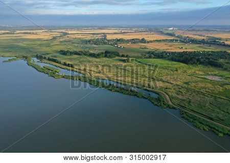 Drone Aerial Perspective View On Agricultural Part Of Jamni Lake With Fields And Meadows.