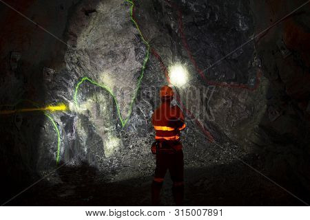 Underground Geologist In A Deep Mining Tunnel