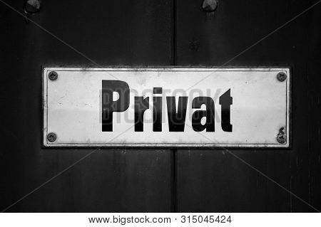 Privat Metal Sign Mounted On A Door