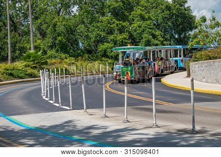 Florida. July 12, 2019 Trams Used To Transport Visitors Between The Parking Lot And The Entrance (1)