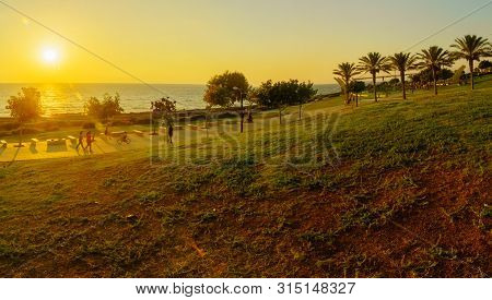 Haifa, Israel - July 31, 2019: Sunset View Of Hecht And Shikmona Parks And The Beach Promenade, With