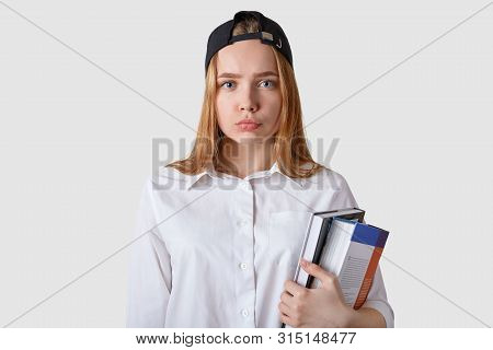Young Student Has Bad Result Of Exam, Posing With Serious And Upset Facial Expression. Schoolgirl St
