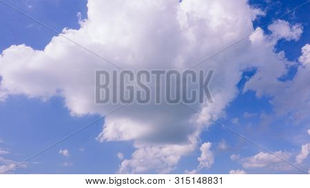 Beautiful Bright Blue Sky With White Fluffy Clouds On A Clear Sunny Day. Royalty High-quality Free S