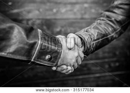 Partnership And Business Deal. Successful Deal Handshake. Handshake Approving Sign. Agreement Compro