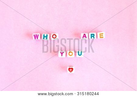 Phrase Who Are You Made Out Of Beads On Bright Background