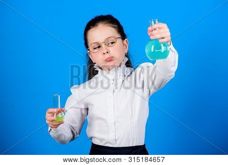 Small Smart Girl With Testing Flask. Back To School. Education And Knowledge. Child Study Bilogy Les