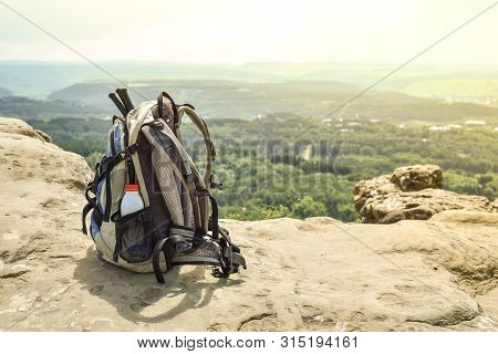 Hipster Hiker Tourist Backpack On Background Nature In Mountain, Blurred Panoramic Landscape, Travel