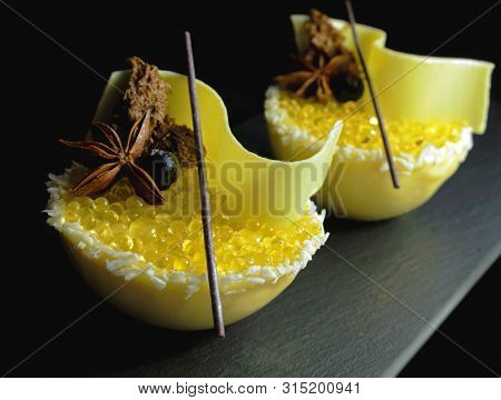 Underwater Yellow Lemon Jelly Caviar And White Melon Mousse Dessert With Coconut, Honey, White Choco