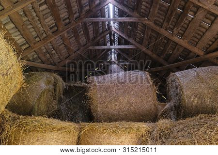 Round Hay Bales In Barn
