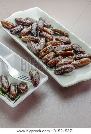 A Tray Of Sweet Juicy Crinkly Dates Ready To Eat.
