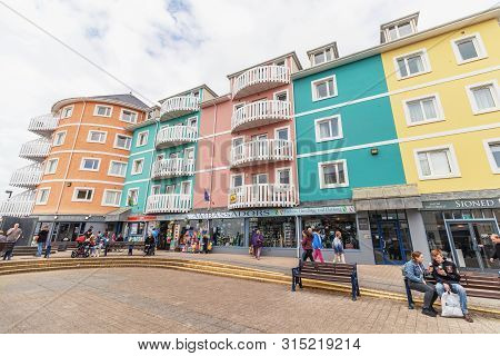 Aberystwyth, Wales / Uk - July 20th 2019 -  Colourful Houses And Shops By The Sea Front In The Seasi