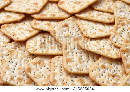 Tuc Original Snack Crackers Lies On Market Table Stacked In Big Pile
