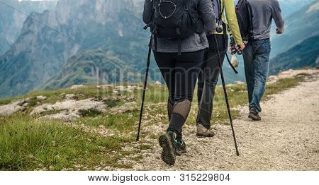 Tourists On The Mountain Trailhead. Summer Time Recreation.
