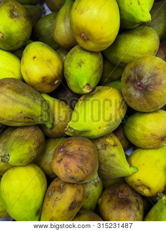 A Lot Of Juicy, Sweet, Appetizing Figs On The Market In The Summer In The City Of Maikop Republic Of