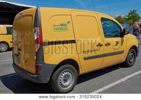 Guilvinec, Brittany, France - July 08, 2019: Yellow Car Of La Poste - French National Postal Service