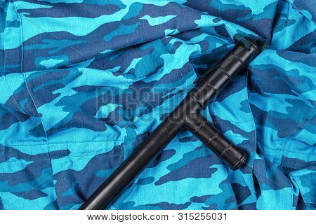 Black Rubber Baton On Blue Urban Russian Riot Police Camouflage Flat Lay