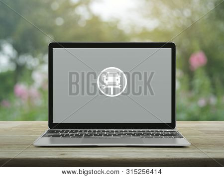 Service Fix Car With Wrench Tool Flat Icon On Modern Laptop Computer On Wooden Table Over Blur Pink 