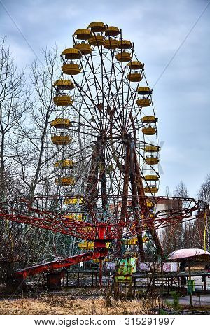 Old Ferris Wheel In The Ghost Town Of Pripyat. Consequences Of The Accident At The Chernobil Nuclear