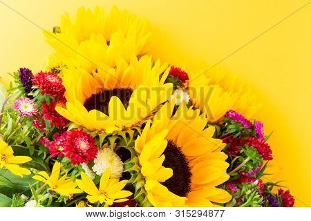 Sunflowers And Aster Fresh Flowers, Top View On Yellow Background, Top View, Naturall Fall Flowers B