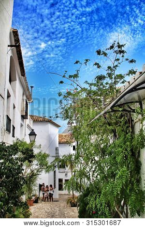 Altea, Alicante, Spain- September 19, 2018:narrow Streets And Beautiful White Facades In A Sunny Day