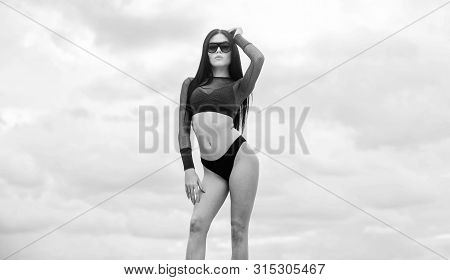 Resort And Vacation. Sexy Fashionable Lady. Sun Tanning Skin Care. Impeccable Swimsuit. Flirty Beaut