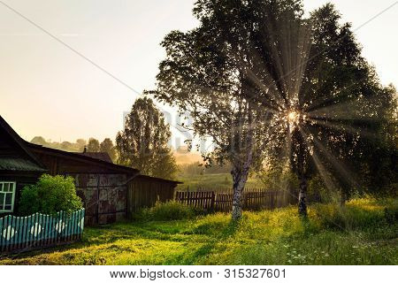 Sunrise In The Russian Village Of Visim, Situated In Ural Mountains. Traditional Wooden Residential 
