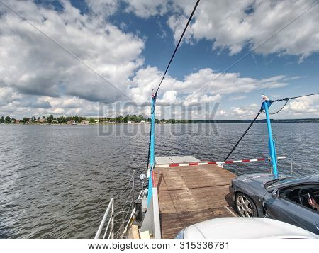 Shipping On Ferry Boat Ship With Open Ramp And Empty Car Deck. Wooden Board For Cars And Passenger