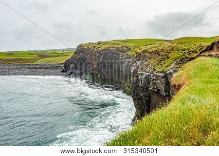 Vertical Cliff Wall Next To A Beach On The Coastal Walk Route From Doolin To The Cliffs Of Moher, Wi