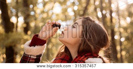 Woman Makes A Cure For The Common Cold In Autumn Park. Young Woman With Handkerchief. Sick People Ha