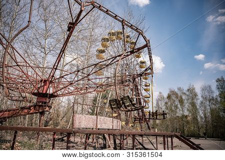 Old Ferris Wheel In The Ghost Town Of Pripyat. Consequences Of The Accident At The Chernobyl Nuclear