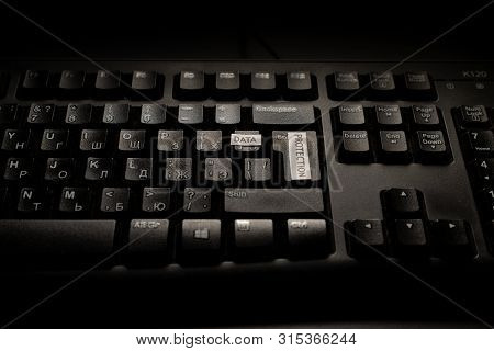 Black Keyboard With Letters Is On The Black Table/background. Notes 