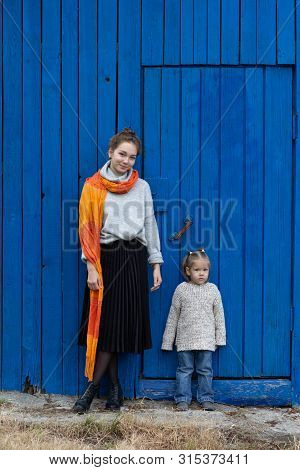 Young Woman Hugging Child With Love And Tenderness