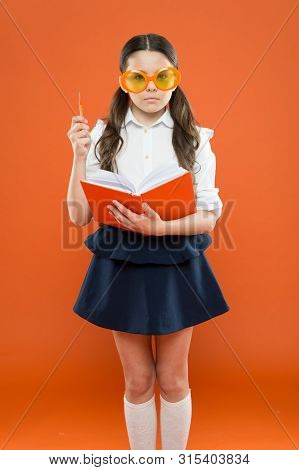Study Literature. Pupil Likes Study. Small Girl Enjoying Her School Time. Happy Little Schoolgirl Re