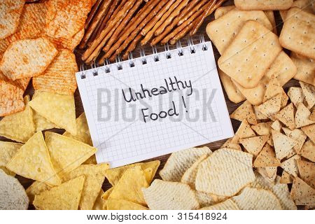 Inscription Unhealthy Food In Notebook, Crunchy Potato Crisps, Breadsticks And Cookies, Concept Of R